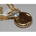 A 9ct gold, topaz and diamond-set ring and a circular yellow metal enclosed locket on 9ct gold