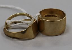 A 9ct gold wide wedding band, a 9ct gold signet ring and a 9ct gold wedding ring