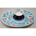 A Gardiner Moscow cup and saucer and a floral charger