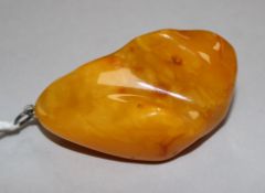 A large yellow amber pendant, 66mm