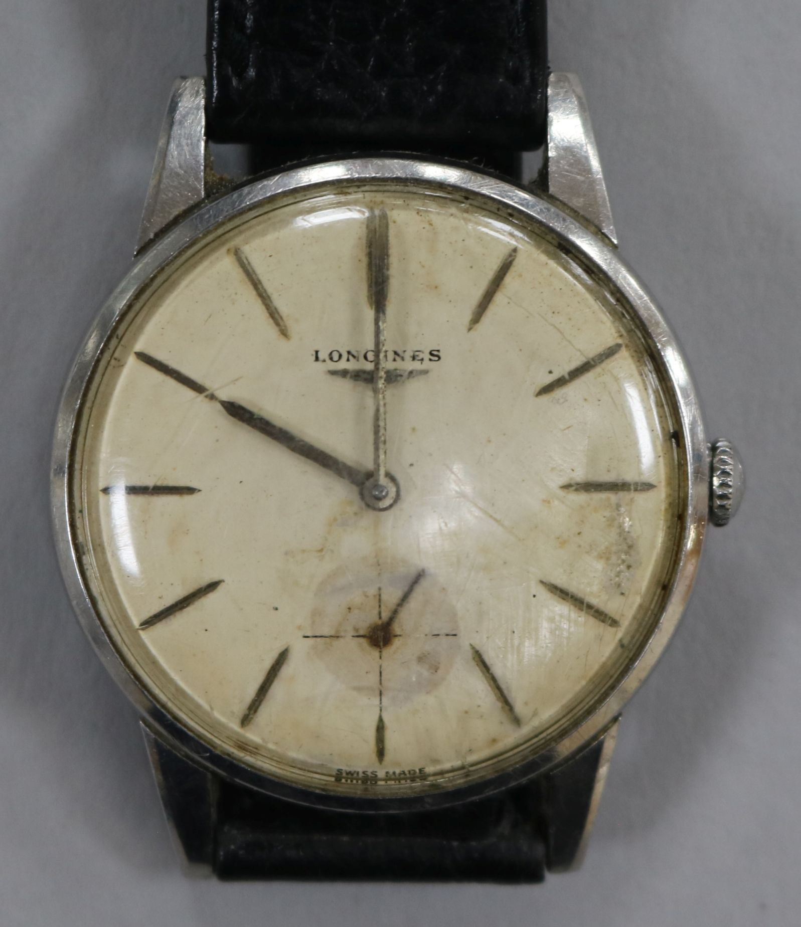 A gentleman's steel Longines manual wind wrist watch.