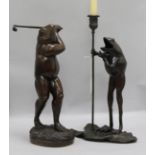 Bronze candlesticks and a golfer