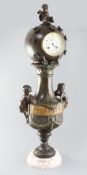A 19th century French bronzed spelter mantel timepiece, of globe and urn form, 28in.