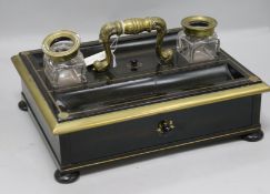 A brass mounted ebony inkstand