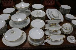 An extensive matched white-glazed and gilt-bordered part dinner service, mainly by Rosenthal but
