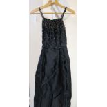 A Blanes of London vintage ball gown, black silk with bead and sequin decoration to bodice,