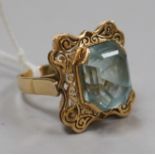 A yellow metal and fancy cut aquamarine set dress ring, size R