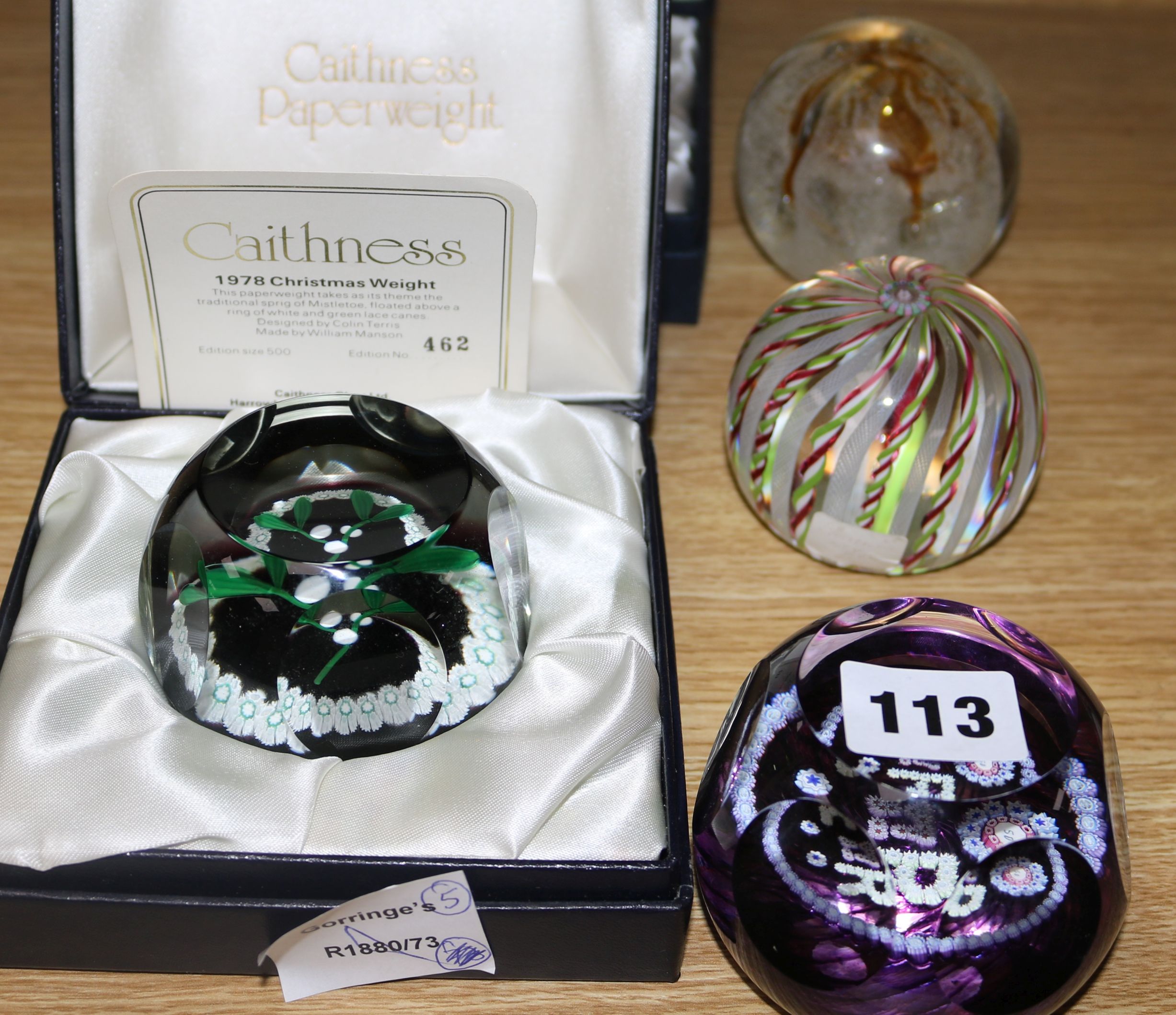 Five Caithness glass paperweights, two boxed and made by William Manson