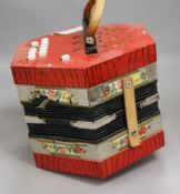 A concertina, boxed