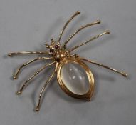 A 14ct gold and gem set spider brooch with chatoyant cabochon quartz body, width 52mm.