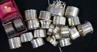 23 silver napkin rings, various, including one cased pair, another pair and a matched set of four,