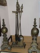A pair of andirons and fire tools