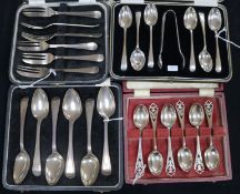 Four sets of cased silver flatware, including a set of six coffee spoons and tongs, a set of six