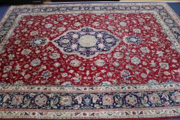 A Tabriz red ground carpet, 340 x 250cm