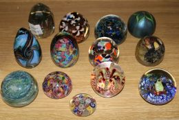 Twelve various glass paperweights, including Orient and Flume, Mdina, Isle of Wight, etc.