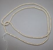 An opera length single strand cultured pearl necklace, 116cm.