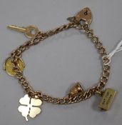 A 9ct gold charm bracelet with padlock clasp hung with five charms, three 9ct, one 14K and one