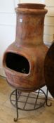 A chimney stove on stand, H.122cm