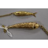 A yellow metal articulated fish pendant on chain, 12.4gr and a similar smaller fish pendant on