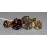 Two garnet set rings, one 14ct, one 9ct and two 9ct gold quartz set rings.