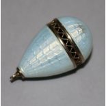 A pale blue guilloche enamelled egg charm, 29mm.