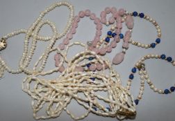 Four various necklaces, including a five-strand freshwater pearl necklace with 'bow' clasp, a single