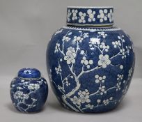 A large Chinese prunus jar and cover and another small jar