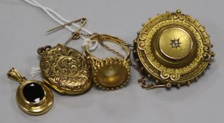 An 18ct gold and citrine ring, an 18ct gold gem set pendant , a locket and a Victorian gold and