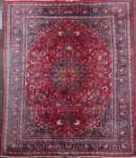 A Tabriz red ground carpet, 292 x 380cm