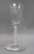 An 18th century wine glass with bell shaped bowl, vine etched bowl and double corkscrew gauze stem