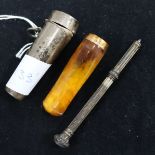 A silver cased amber cigar holder with gold mount and a propelling pencil.