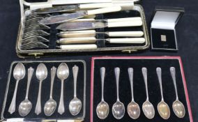 Two sets of six silver coffee spoons, 12 pairs of plated fish eaters and servers (all cased) and a