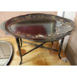 A Victorian shaped oval papier mache tray, on stand (a.f.), W.84cm