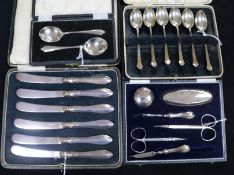 A six-piece silver-mounted manicure set, cased and three cased sets of flatware, including six