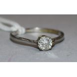A white metal and solitaire diamond ring, size Q.