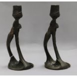 A pair of Secessionist bronze candlesticks