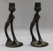 A pair of Secessionist bronze candlesticks