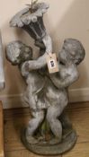 A lead garden fountain modelled as cherubs, H.56cm