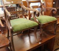 A pair of elbow chairs