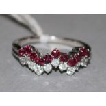 A ruby and diamond zig-zag line-set ring, 18ct white gold shank