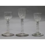 Three early 18th century facet stem rose engraved glasses