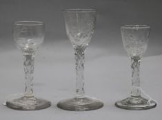 Three early 18th century facet stem rose engraved glasses