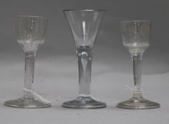 Three George II drinking glasses, with folded feet