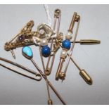 A 9ct gold saxophone stick pin, a similar initial pin and tiepin and five various unmarked items,