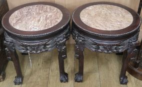 A pair of Chinese hardwood and marble stands H.47cm