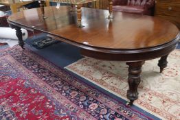 A Victorian mahogany extending dining table with three leaves, W.285cm fully extended