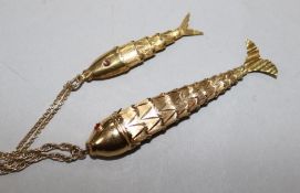 A yellow metal articulated fish pendant on chain, 12.4gr and a similar smaller fish pendant on