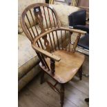 A 19th century ash and elm stick back elbow chair