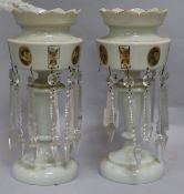 A pair of opaque white glass table lustres