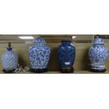 A set of four blue and white table lamp bases